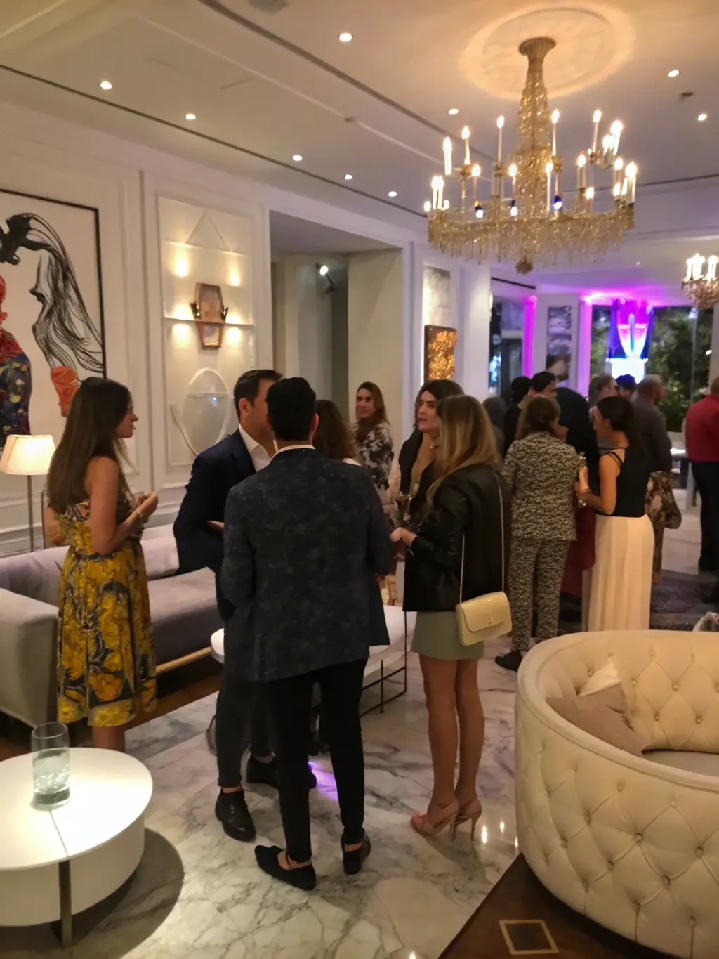 A photograph capturing the energy of a networking event at the fashion conference, showing attendees connecting and exchanging ideas.